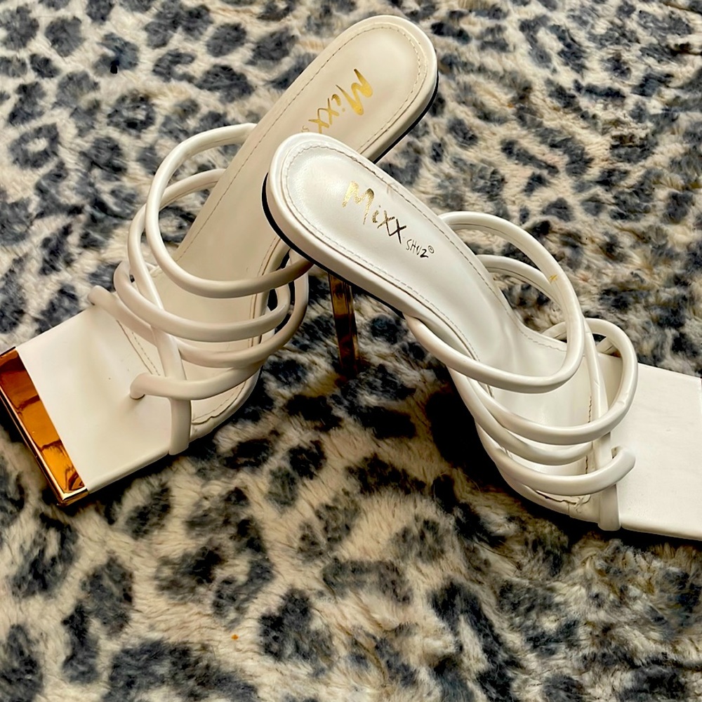 Never been worn white and gold heels.